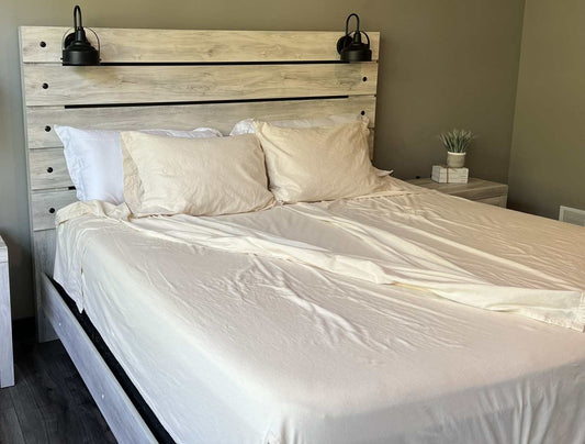 Flannel split sheet set on a bed with a wooden headboard