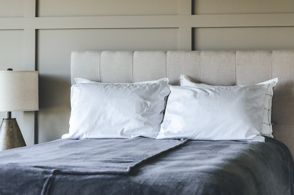 Bedroom showcasing split blanket