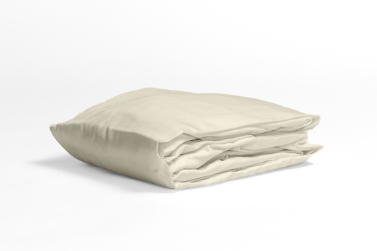 Folded fitted sheet in soft sand