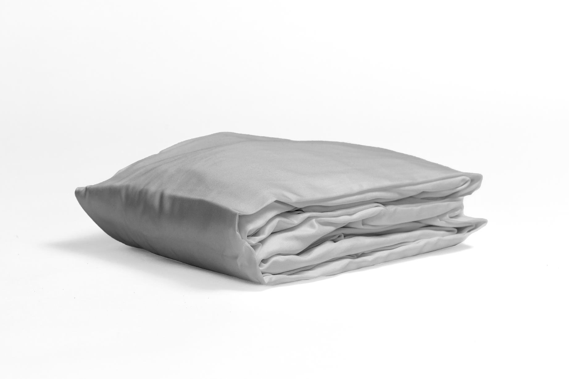 Folded fitted sheet in moonlit mist