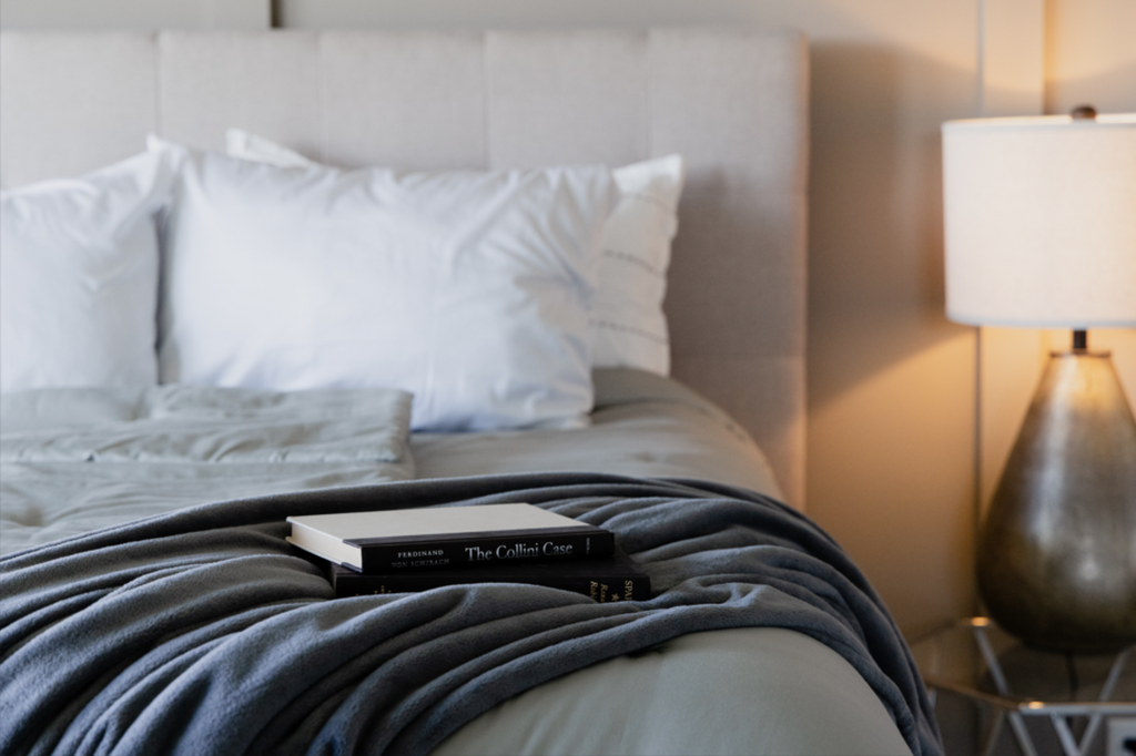 Close up of bed made with books