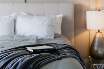 Close up of bed made with books