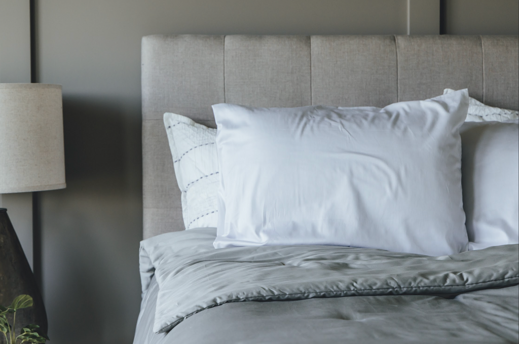 Close up on comforter on side of bed