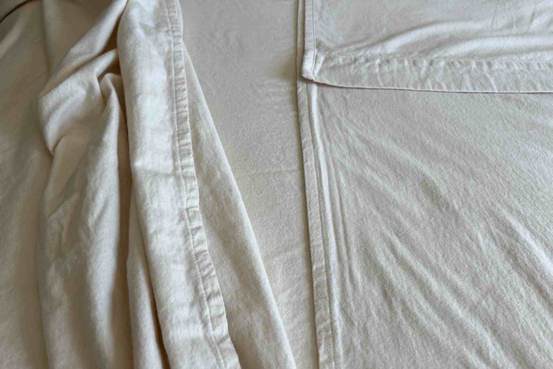 Close-up of flannel split sheet with visible texture and folds.